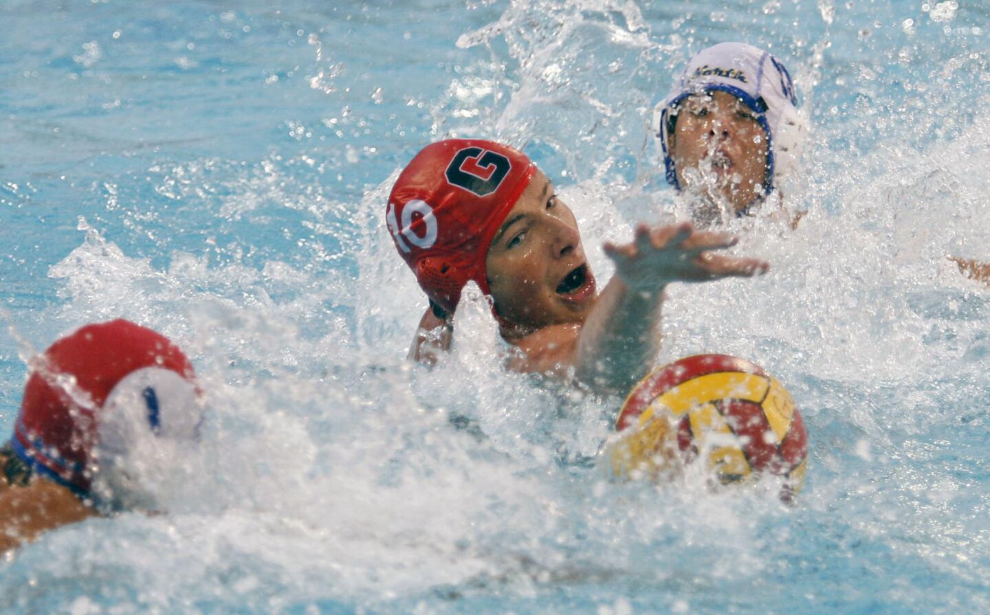 Glendale's Arman Momdzhyan, center, fights for the ball during the CIF Southern Southern Section Division V playoffs against JW North, which took place at Burbank High School on Wednesday, November 7, 2012.