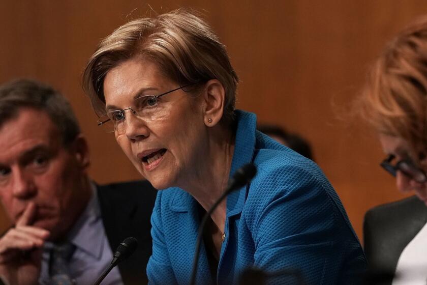 WASHINGTON, DC - JULY 19: U.S. Sen. Elizabeth Warren (D-MA) (2nd L) speaks as Sen. Mark Warner (D-VA) (L) listens during a confirmation hearing before the Senate Committee on Banking, Housing, and Urban Affairs July 19, 2018 on Capitol Hill in Washington, DC. Reed will become the president of the Export-Import Bank of the United States if confirmed by the Senate. (Photo by Alex Wong/Getty Images) ** OUTS - ELSENT, FPG, CM - OUTS * NM, PH, VA if sourced by CT, LA or MoD **