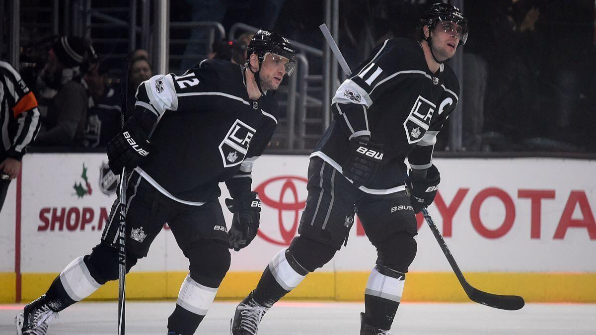 Kings right wing Marian Gaborik, left, skates back to the bench with center Anze Kopitar after scoring a goal, assisted by Kopitar, during the third period against the Minnesota Wild on Tuesday.