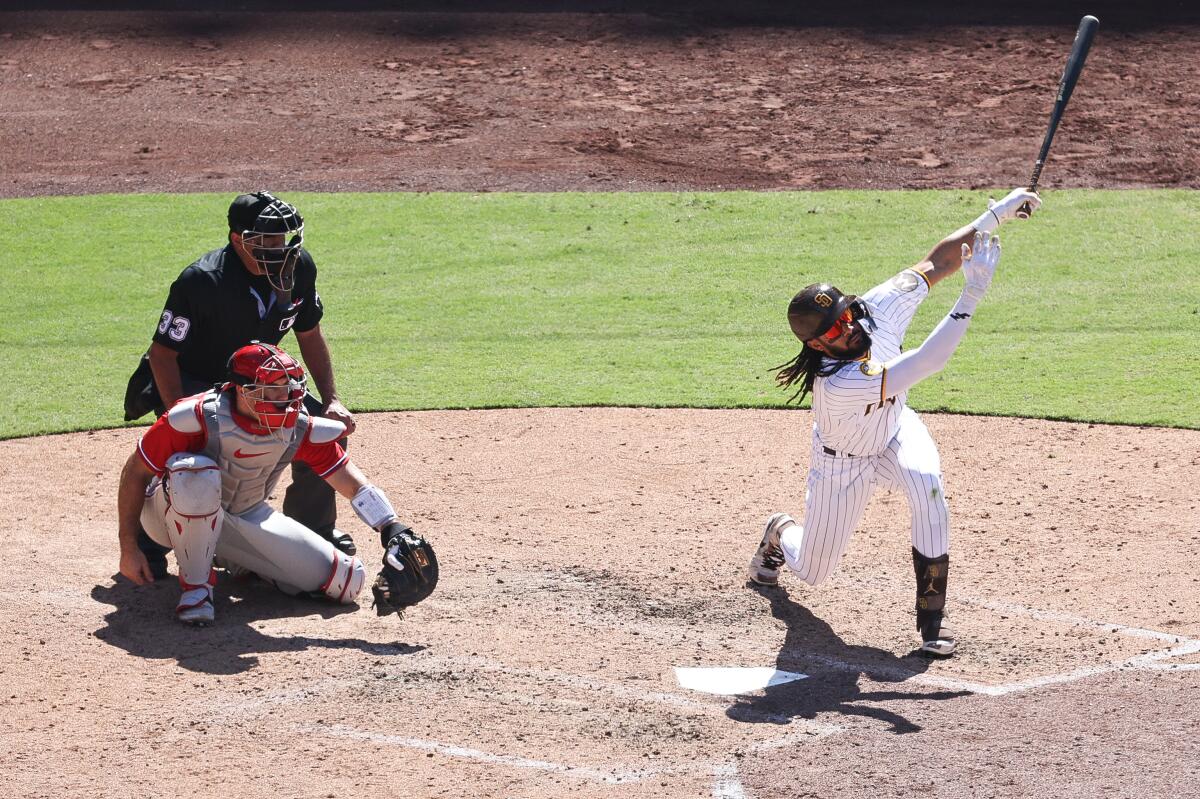 Padres right fielder Fernando Tatis Jr. (23) swings for a strike against the Phillies.