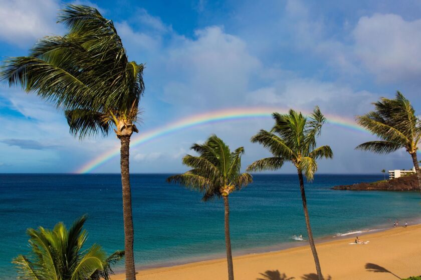 A perfect rainbow on Kaanapali Beach, Maui, Hawaii, forming over Black Rock and into the beautiful sea. ** OUTS - ELSENT, FPG, CM - OUTS * NM, PH, VA if sourced by CT, LA or MoD **
