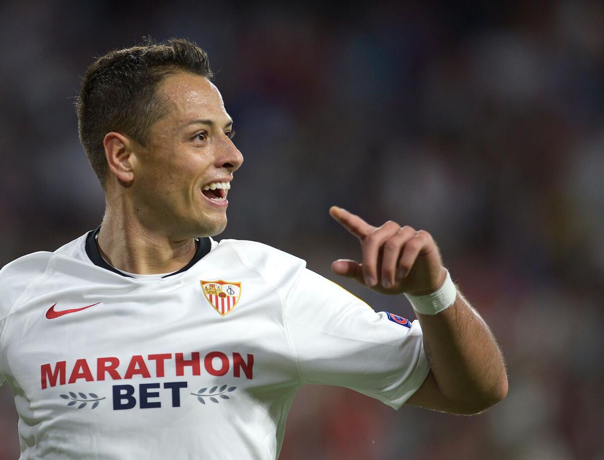 (FILES) In this file photo taken on October 03, 2019 Sevilla's Mexican forward Chicharito celebrates after scoring during the UEFA Europa League group A football match between Sevilla and APOEL Nicosia at the Ramon Sanchez Pizjuan stadium in Seville. - The Los Angeles Galaxy have signed Mexico striker Javier "Chicharito" Hernandez from Sevilla and will make him the highest-paid player in Major League Soccer, Sports Illustrated reported January 17, 2020. Galaxy will be counting on Chicharito, who is Mexico's all-time leading goal-scorer, to fill the star-power and scoring void left by the departure of Zlatan Ibrahimovic, the Swedish star who returned to AC Milan in December. (Photo by CRISTINA QUICLER / AFP) (Photo by CRISTINA QUICLER/AFP via Getty Images) ** OUTS - ELSENT, FPG, CM - OUTS * NM, PH, VA if sourced by CT, LA or MoD **