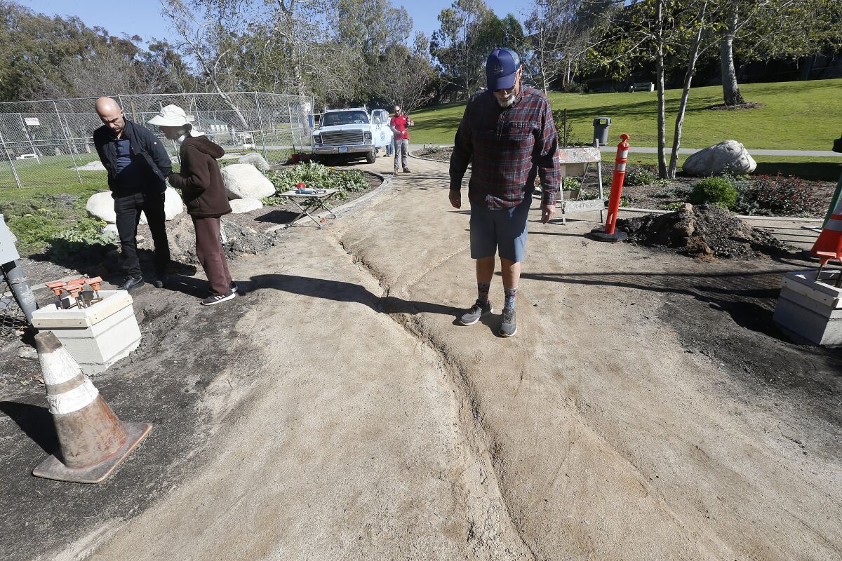 Project Manager Steve Engel looks at one of the rutted paths in the Secret Garden.