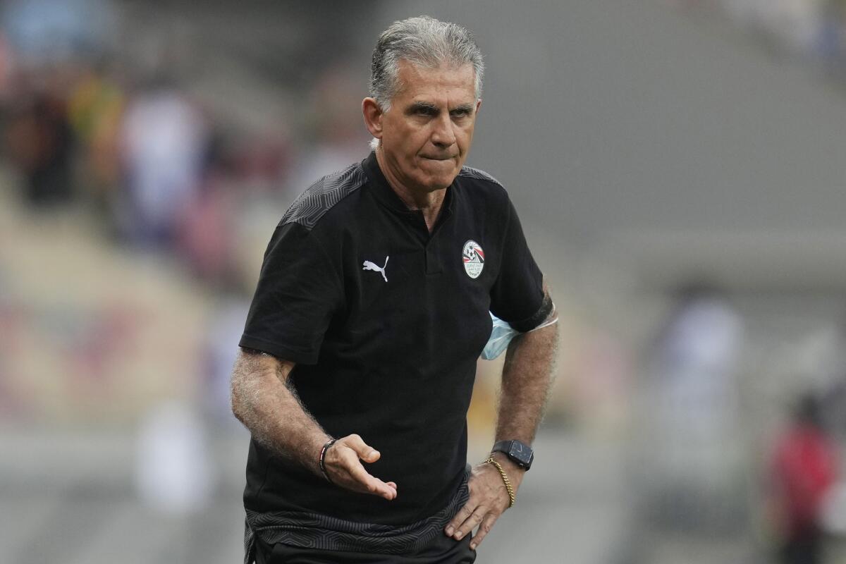 FILE - Then Egypt's head coach Carlos Queiroz gives instructions to his players during the African Cup of Nations 2022 round of 16 soccer match between Ivory Coast and Egypt at the Japoma Stadium in Douala, Cameroon, on Jan. 26, 2022. Queiroz could be set for a dramatic return to take charge of Iran’s national team less than three months before the World Cup and Group B games with the United States, England and Wales.(AP Photo/Themba Hadebe, File)