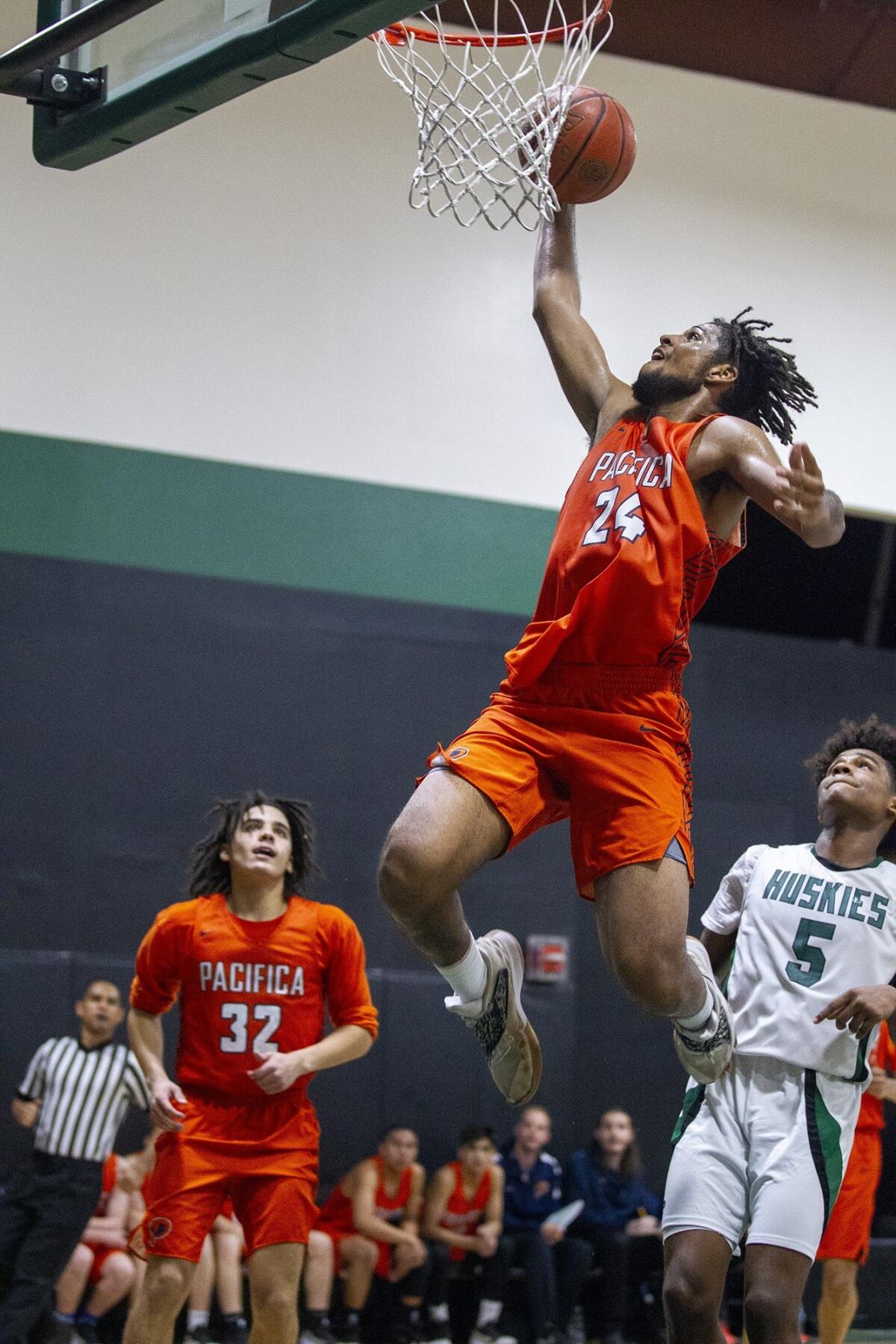 Pacifica Christian Orange County High's Josh Sims goes up for a dunk in a CIF State Southern California Regional Division III quarterfinal playoff game at Fairmont Prep on Thursday.
