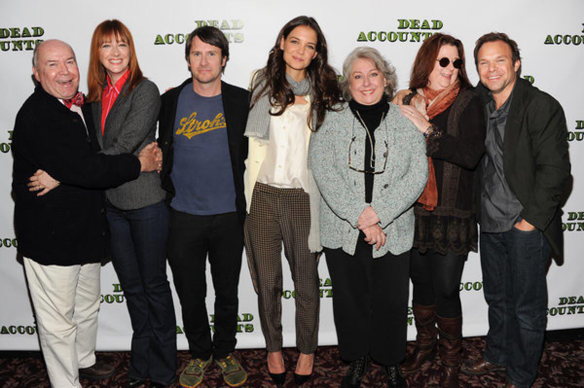 The cast of the Broadway play "Dead Accounts," from left, Jack O'Brien, Judy Greer, Josh Hamilton, Katie Holmes, Jayne Houdyshell, Theresa Rebeck and Norbert Leo Butz pose for a photo in New York.