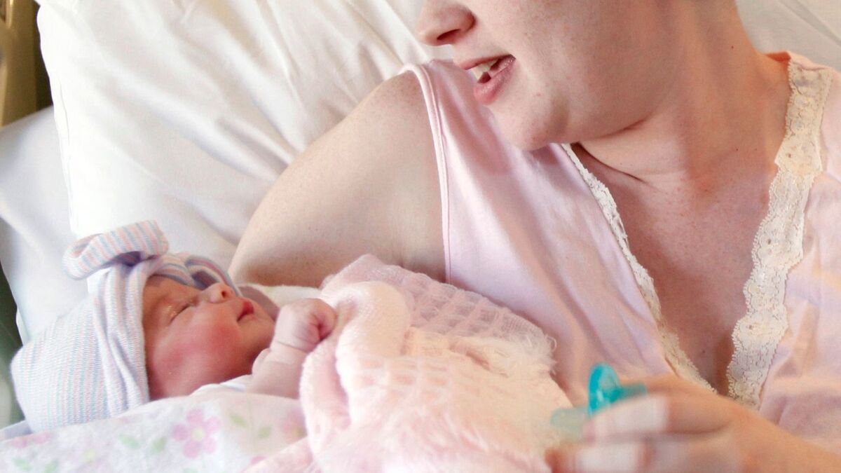 A mother holds her newborn baby at a hospital in Corpus Christi, Texas on Nov. 11, 2011.