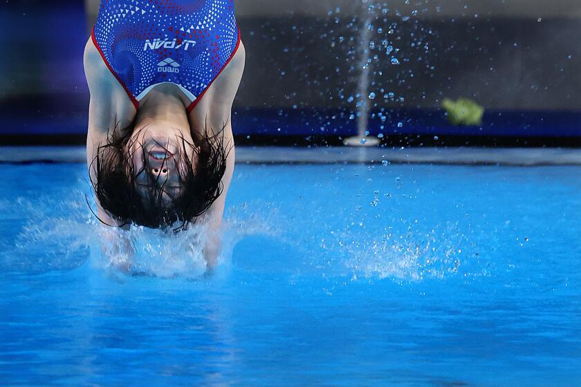 PARIS, FRANCE August 5, 2024-Fans Japan's Matsuri Arai attempts a dive in the women's 10 meter platform preliminaries at the 2024 Paris Olympics Monday. (Skalij/Los Angeles Times)