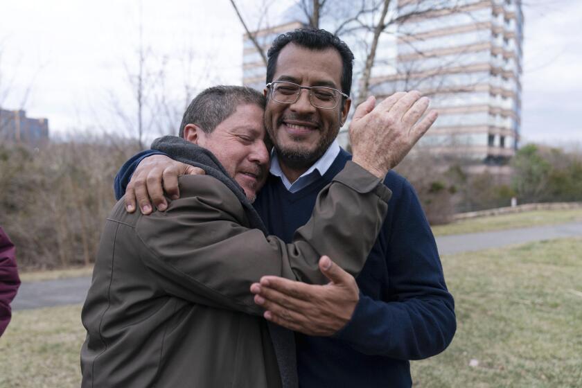 Nicaraguan opposition leader Felix Maradiaga is welcomed by a supporter in Chantilly, Va., Thursday, Feb. 9, 2023. Maradiaga was among some 222 prisoners of the government of Nicaraguan President Daniel Ortega who arrived from Nicaragua to the Washington Dulles International Airport on Thursday, after an apparently negotiated release. (AP Photo/Jose Luis Magana)