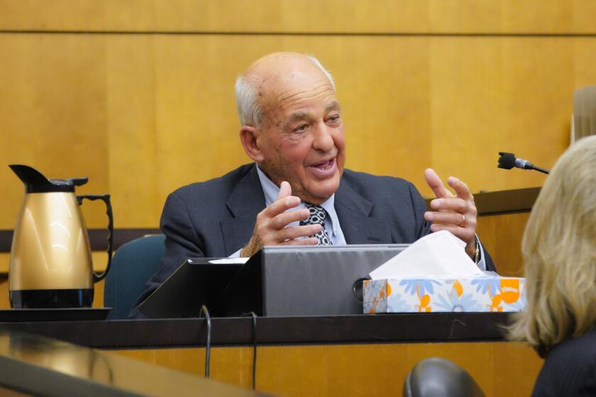 Under cross examine by defense attorney, Dan Webb, Dr. Cyril Wecht, forensic pathologist on the witness stand.