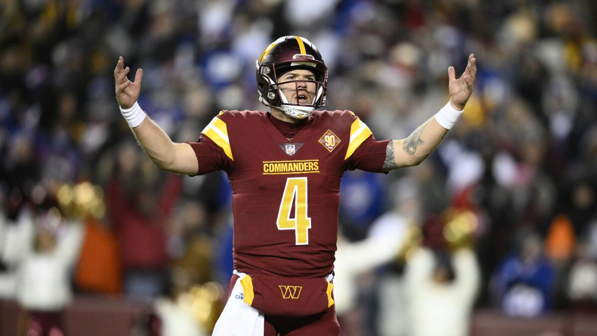 Washington Commanders quarterback Taylor Heinicke gestures during the second half against the New York Giants.