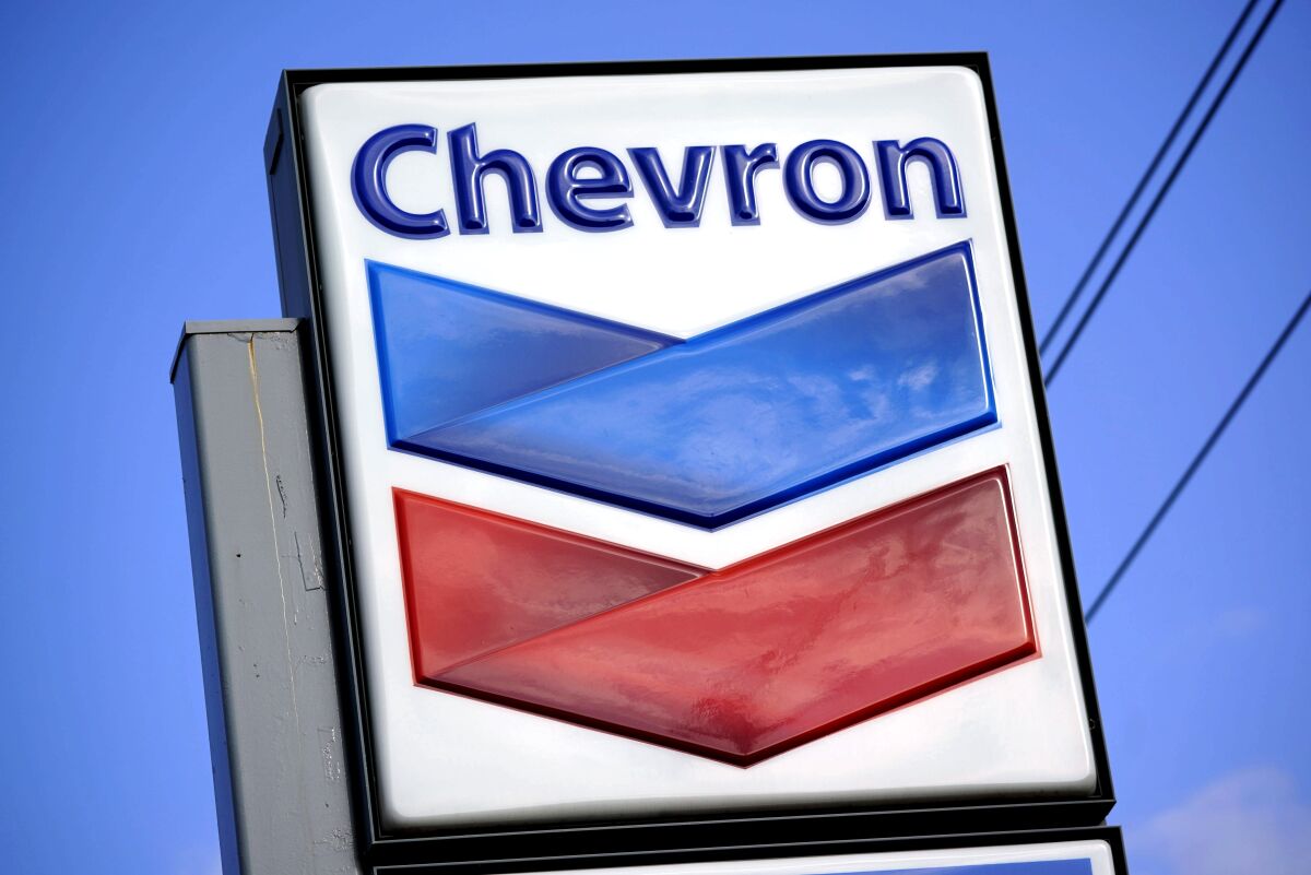 FILE - A Chevron sign is displayed outside one of the company's gas stations in Bradenton, Fla., Feb. 22, 2022. (AP Photo/Gene J. Puskar, File)
