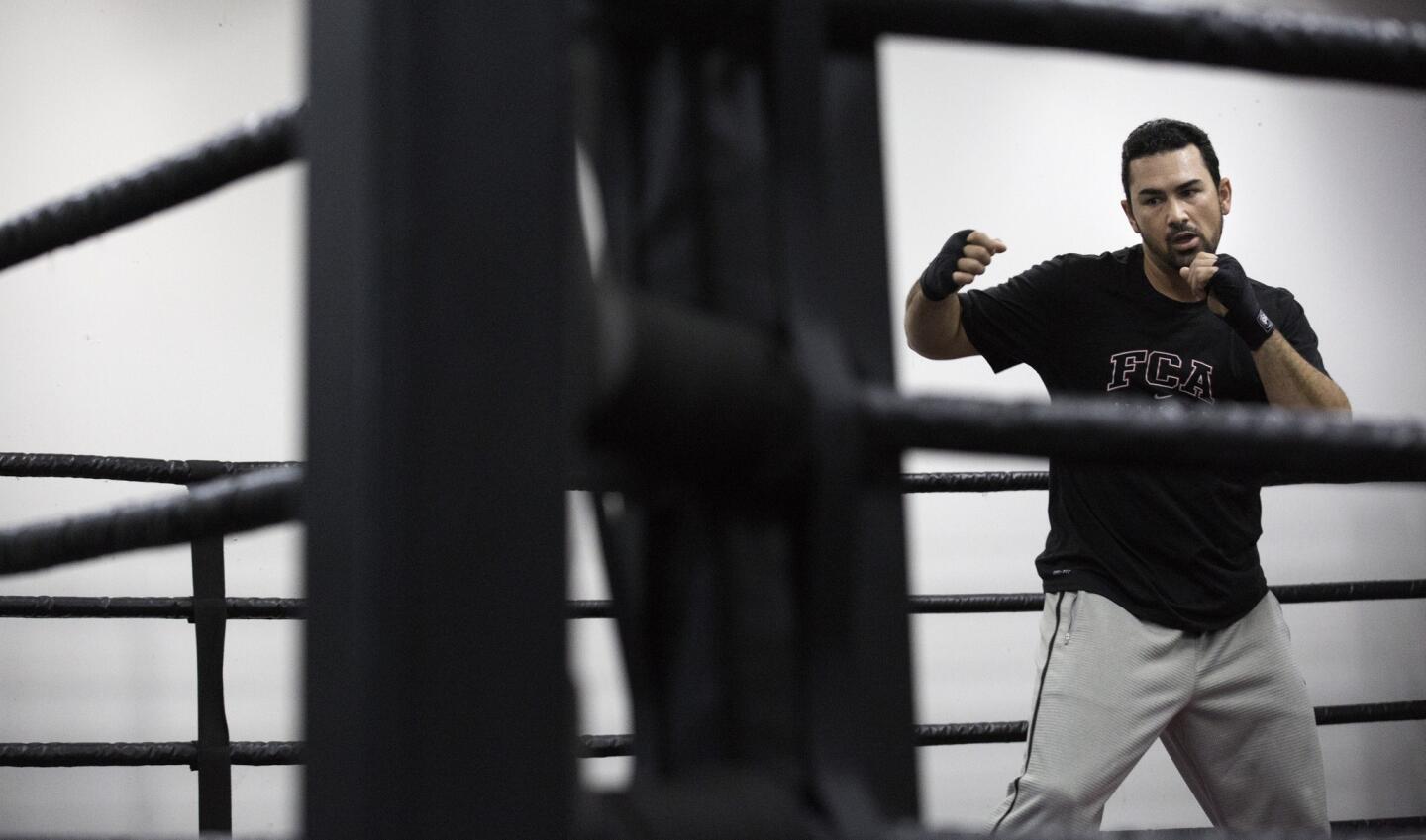 Dodgers first baseman Adrian Gonzalez warms up for his boxing workout at Freddie Roach's Wild Card Boxing Club in Los Angeles.