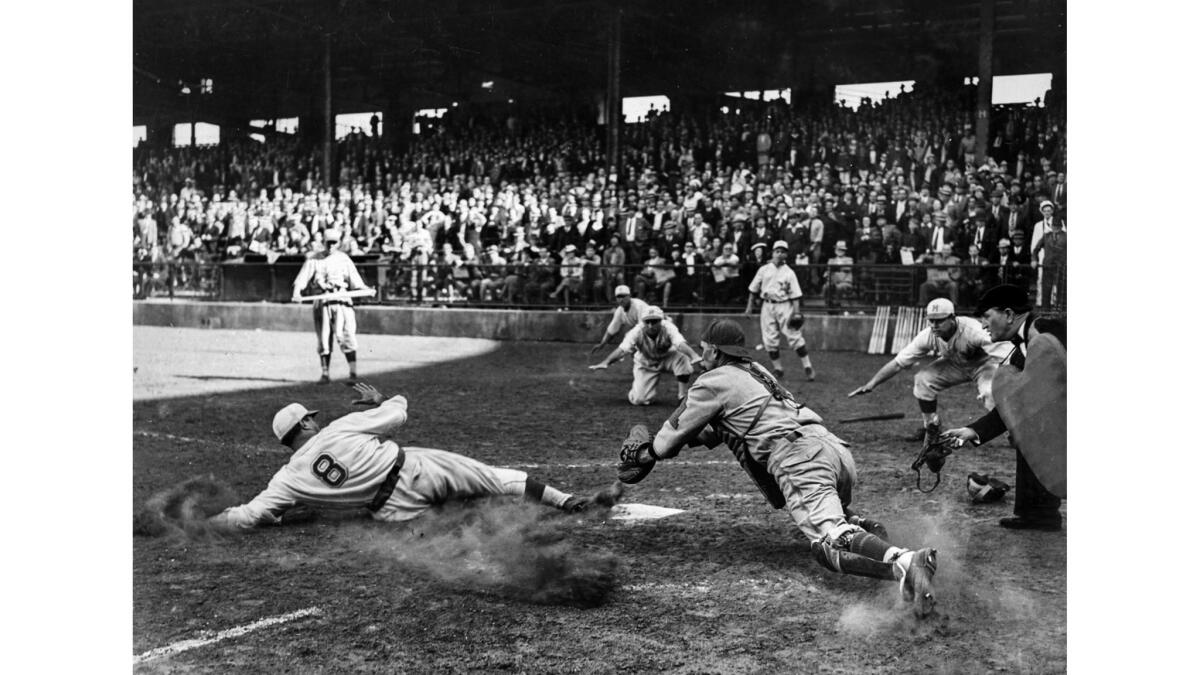 April 10, 1938: Hollywood Stars' Frenchy Uhalt scores the winning run against the San Francisco Seals in Pacific Coast League baseball action.