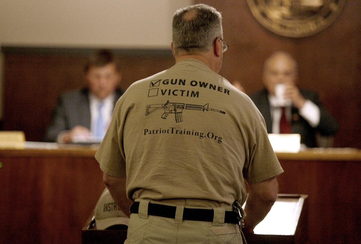 A pro-gun advocate addresses the Glendale City Council on Tuesday. The council directed the city attorney to draft an ordinance to ban the sale of guns on city-owned property.