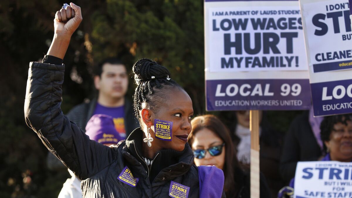 LAUSD bus driver Tanya Walters joins school workers at SEIU Local 99, which represents about 30,000 support workers, as they march at Marlton School in February.