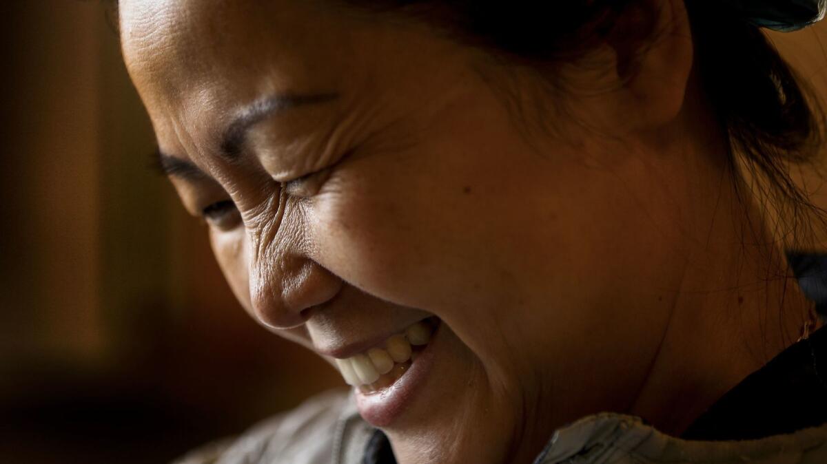 Hue Phan says she finds fulfillment in her Buddhist religion, volunteering to help cook on weekends at the temple. (Mark Boster / Los Angeles Times)