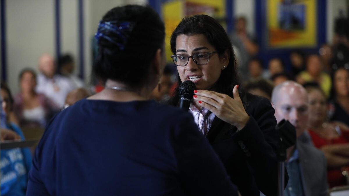 Rep. Nanette Diaz Barragán (D-San Pedro), right, tries to calm the concerns of Compton resident Maria Villarreal during a Water Quality Town Hall hosted at George Washington Elementary School.