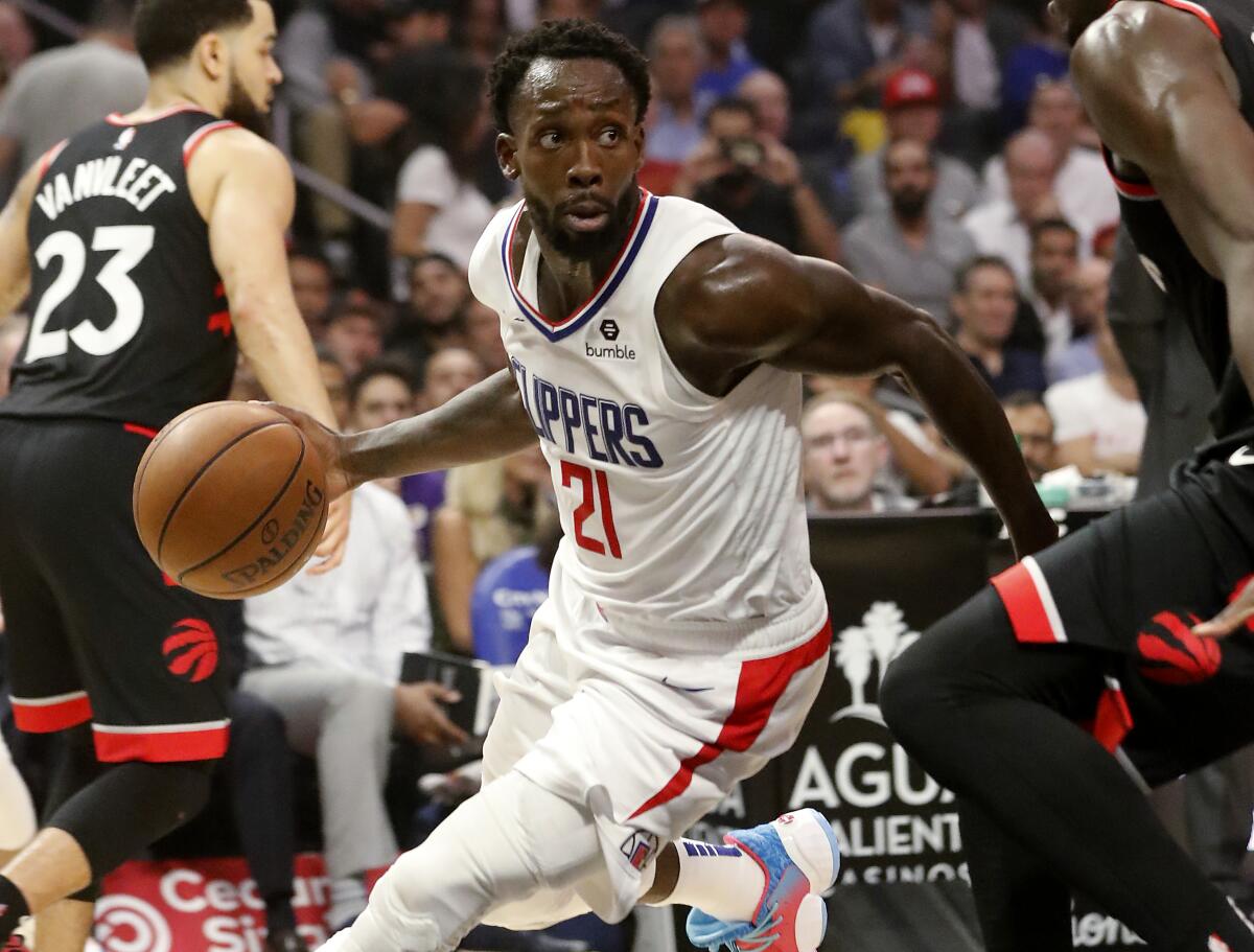Clippers guard Patrick Beverley runs the offense during a game against the Toronto Raptors on Nov. 11, 2019, at Staples Center.