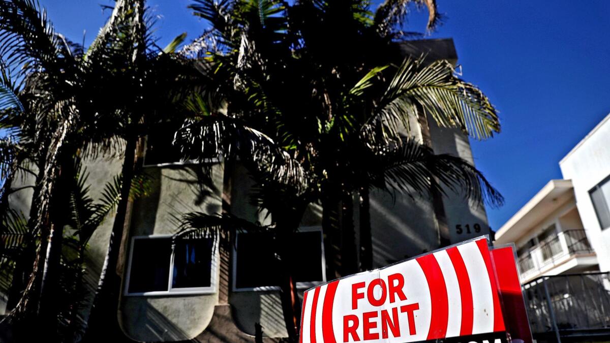 A for-rent sign is posted in front of an apartment building in Los Angeles.