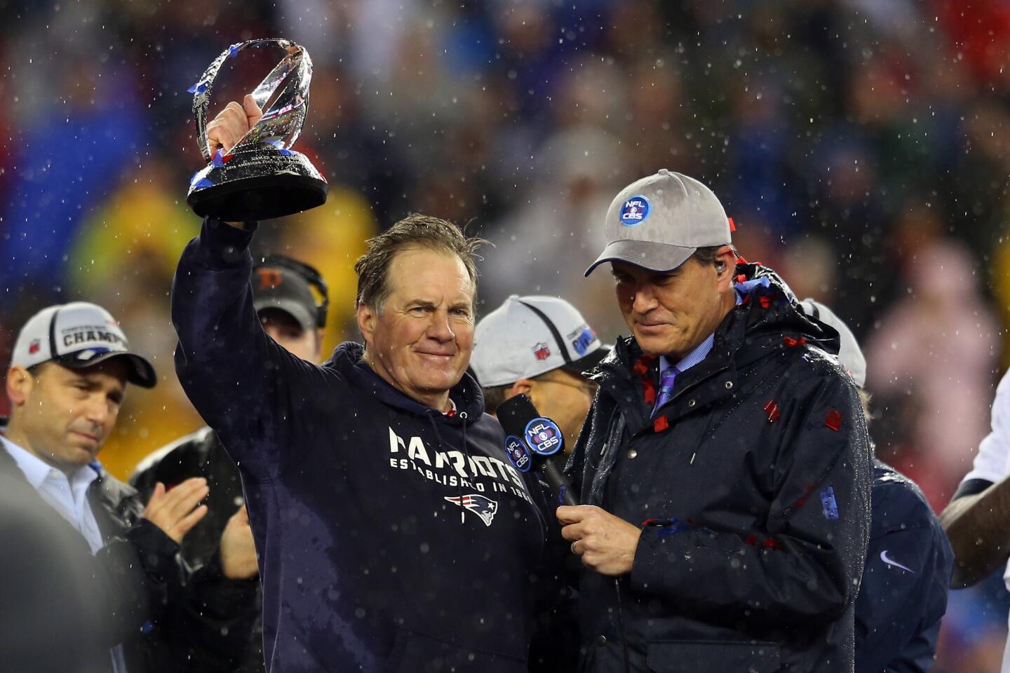 Patriots Coach Bill Belichick raises the Lamar Hunt Trophy after leading New England to a 45-7 victory over the Indianapolis Colts in the AFC championship game on Sunday in Foxborough, Mass.