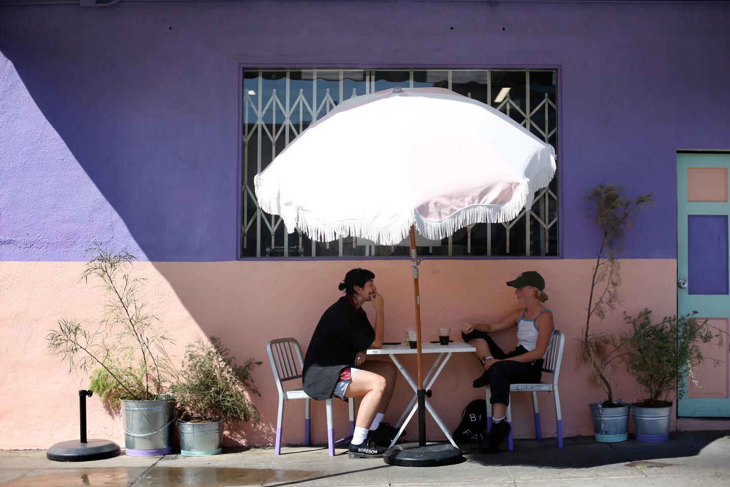 Annalise Gehling, left, and Quincie Bean eat Tuesday at Cafe Tropical in Silver Lake.