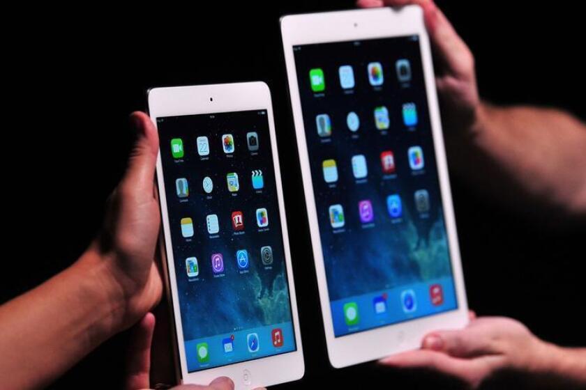 Tablet shipments continue to fall worldwide. Above, the iPad mini 2, at left, and its larger-screen counterpart.