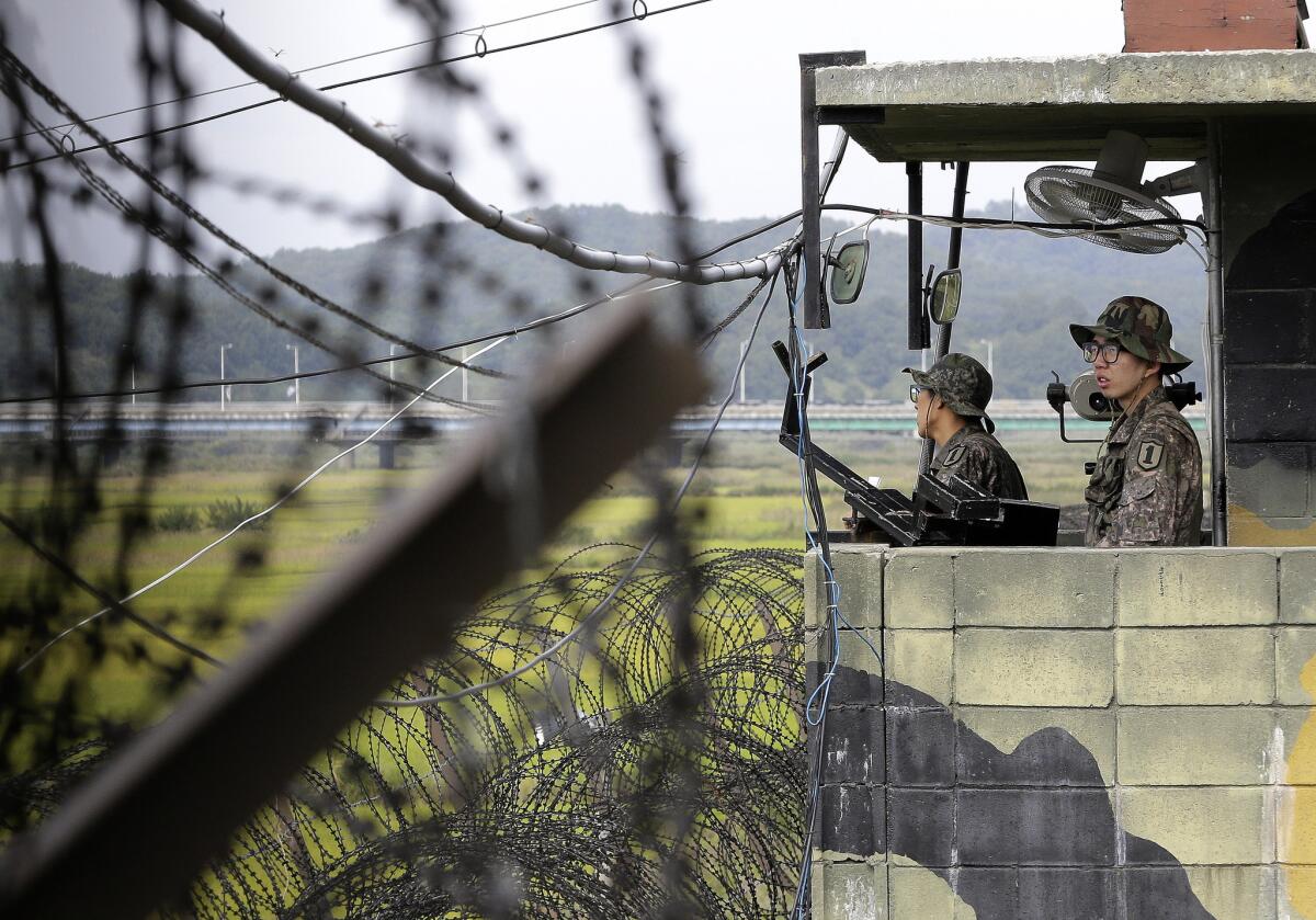 South Korean army soldiers stand guard at a military check point at the Imjingak Pavilion near the border village of Panmunjom. South Korean border guards arrested an American man who they believe was attempting to swim across a river into North Korea.
