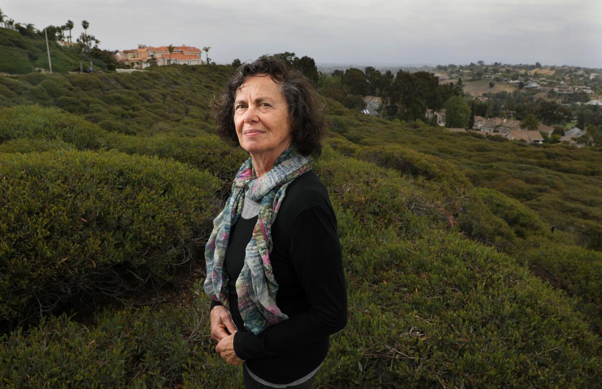 Sara Nuss-Galles on the hillside beside her home