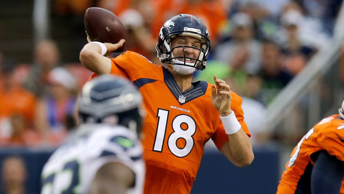 Denver Broncos quarterback Peyton Manning passes during a preseason game against the Seattle Seahawks on Thursday. Manning says the neck injury that nearly derailed his career has made him stronger mentally.