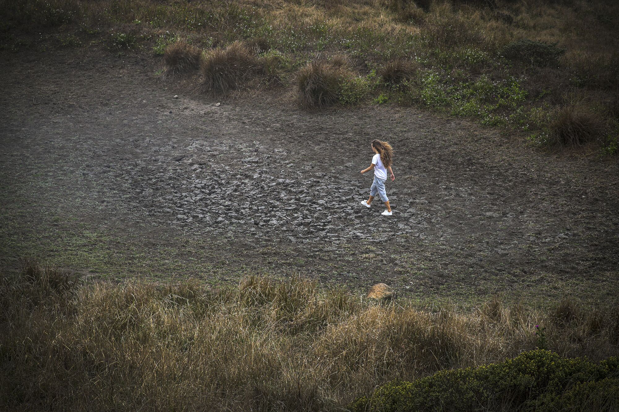 Fleur Dawes walks on a dried pond in Tule Elk Reserve in Point Reyes National Seashore.