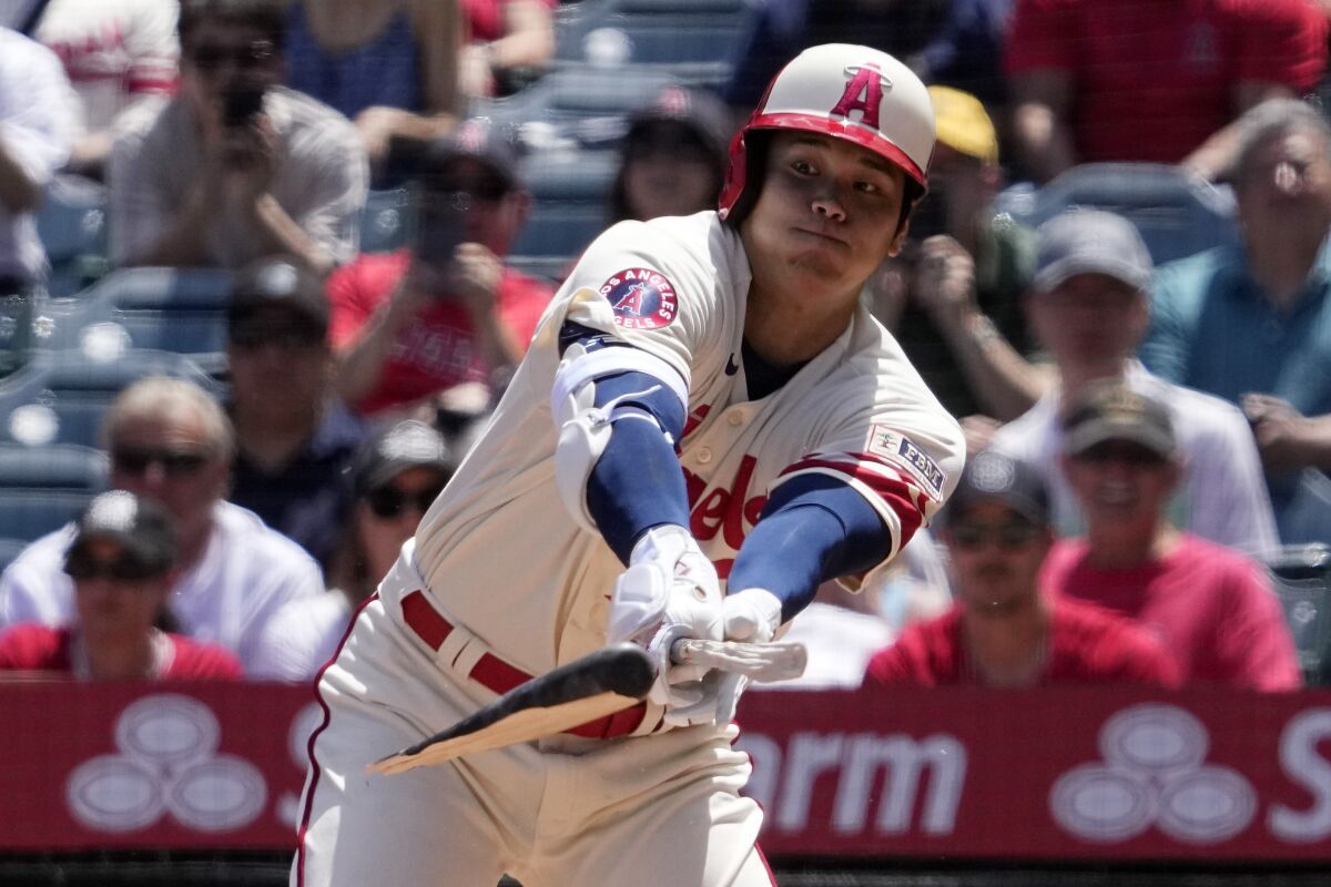 Angels star Shohei Ohtani hits a broken-bat single against the Oakland Athletics.
