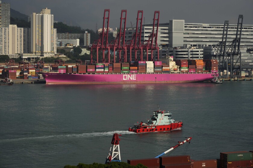 FILE - Shipping containers are seen at a port of Kwai Tsing Container Terminals in Hong Kong, Friday, Nov. 5, 2021. Government data on Friday, Jan. 28, 2022, showed Hong Kong’s economy grew by 6.4% last year after activity weakened as anti-coronavirus controls were tightened. (AP Photo/Kin Cheung, File)