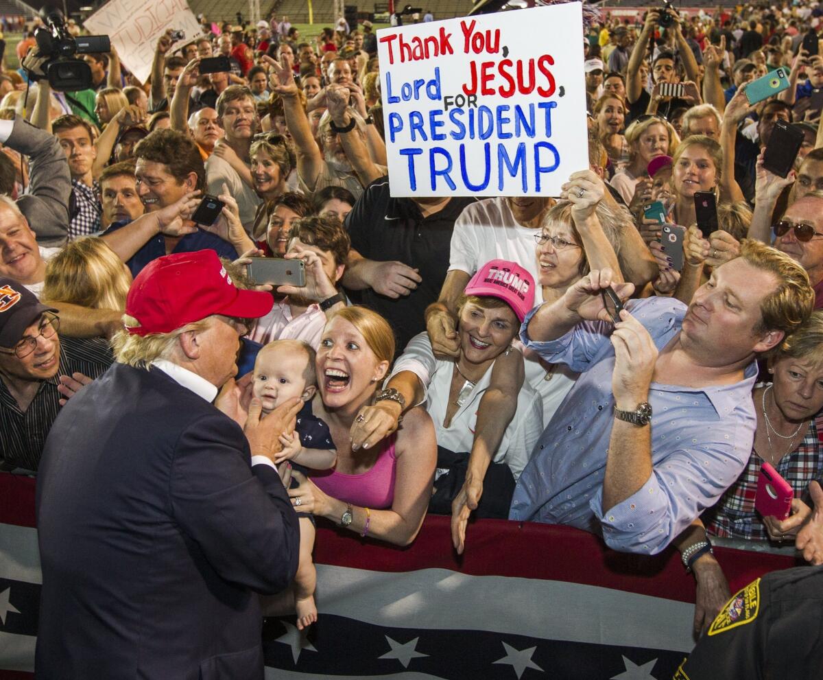 MOBILE, AL- AUGUST 21: Republican presidential candidate Donald Trump greets supporters after his rally at Ladd-Peebles Stadium on August 21, 2015 in Mobile, Alabama. The Trump campaign moved tonight's rally to a larger stadium to accommodate demand. (Photo by Mark Wallheiser/Getty Images) *** BESTPIX *** ** OUTS - ELSENT, FPG - OUTS * NM, PH, VA if sourced by CT, LA or MoD **