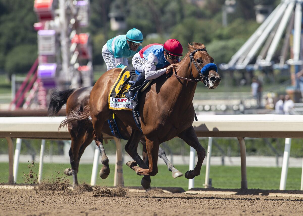 Taiba and jockey Mike Smith, outside, overpower Messier and jockey John Velazquez.