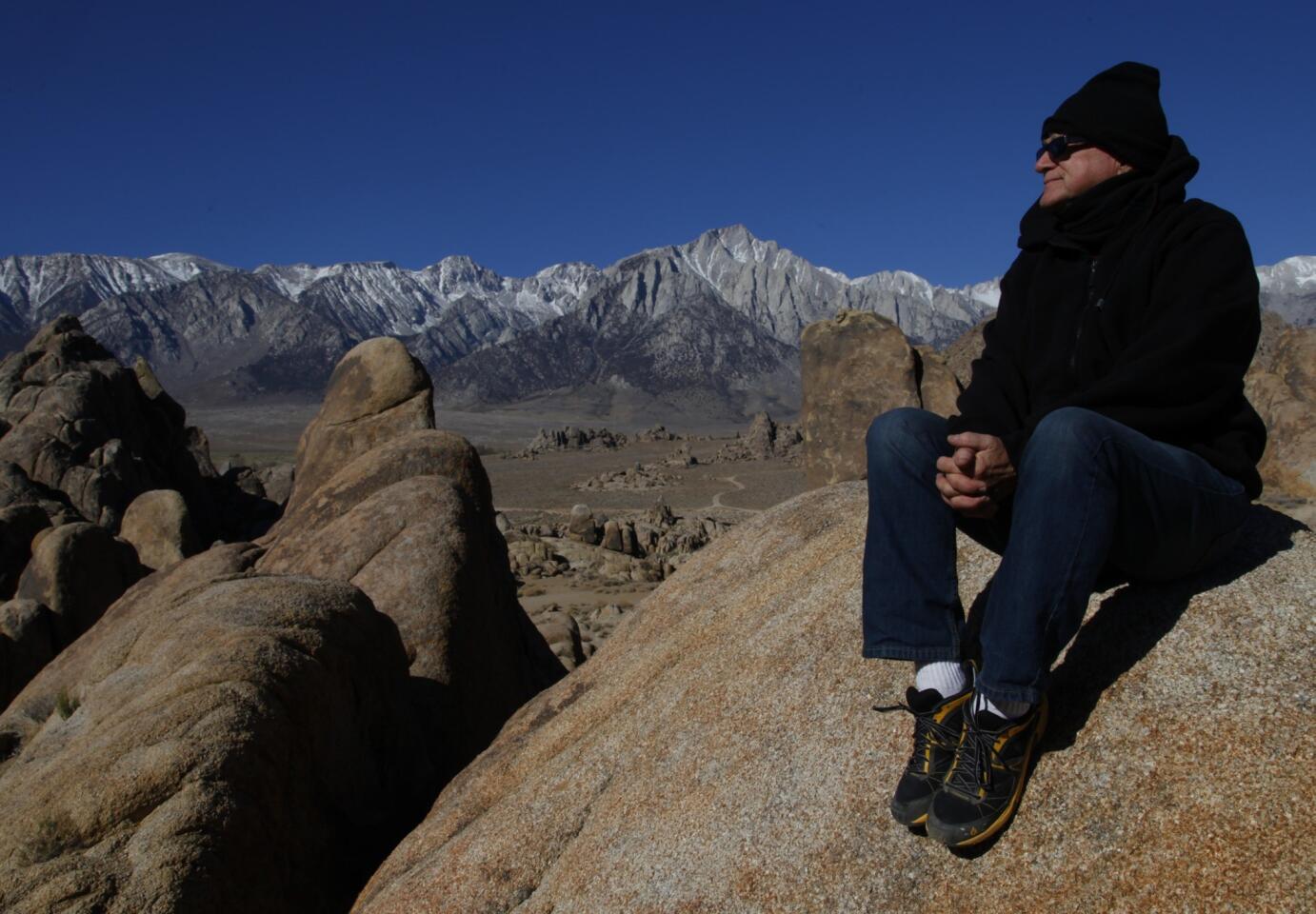 Chris Langley, executive director of the Lone Pine Film History Museum and the Inyo County film commissioner, sits among the rocks in the Alabama Hills in the Eastern Sierra Nevada near Lone Pine. The Alabama Hills have been a favorite backdrop for hundreds of movies, television shows and commercials.