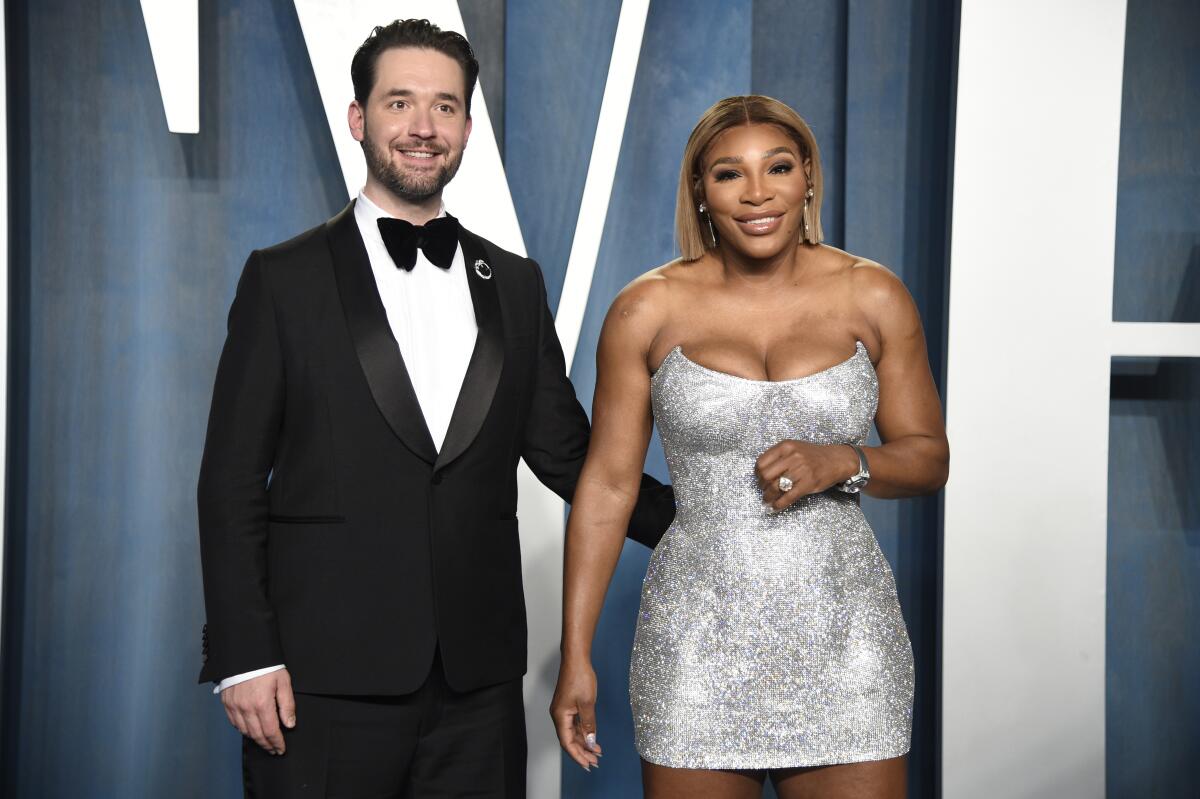 Alexis Ohanian and Serena Williams arrive at an Oscars party in a tuxedo and mini-dress, respectively