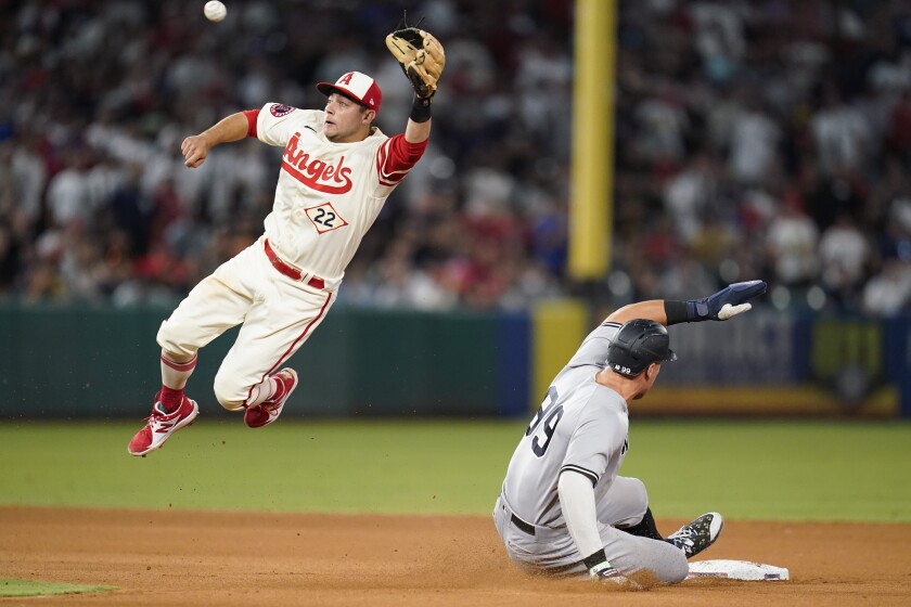 New York Yankees' Aaron Judge steals second base ahead of a throw to Angels shortstop David Fletcher.