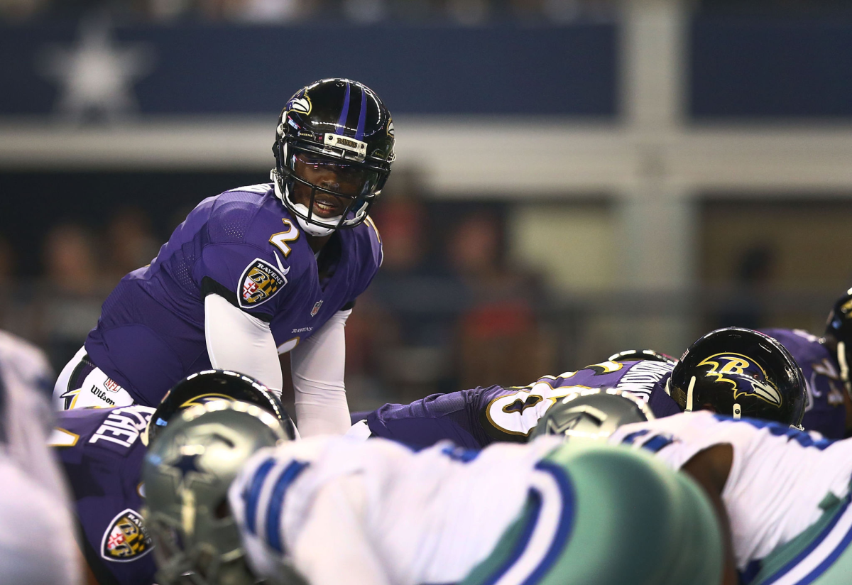 Tyrod Taylor stands under center during a 2014 preseason game between the Baltimore Ravens and Dallas Cowboys.
