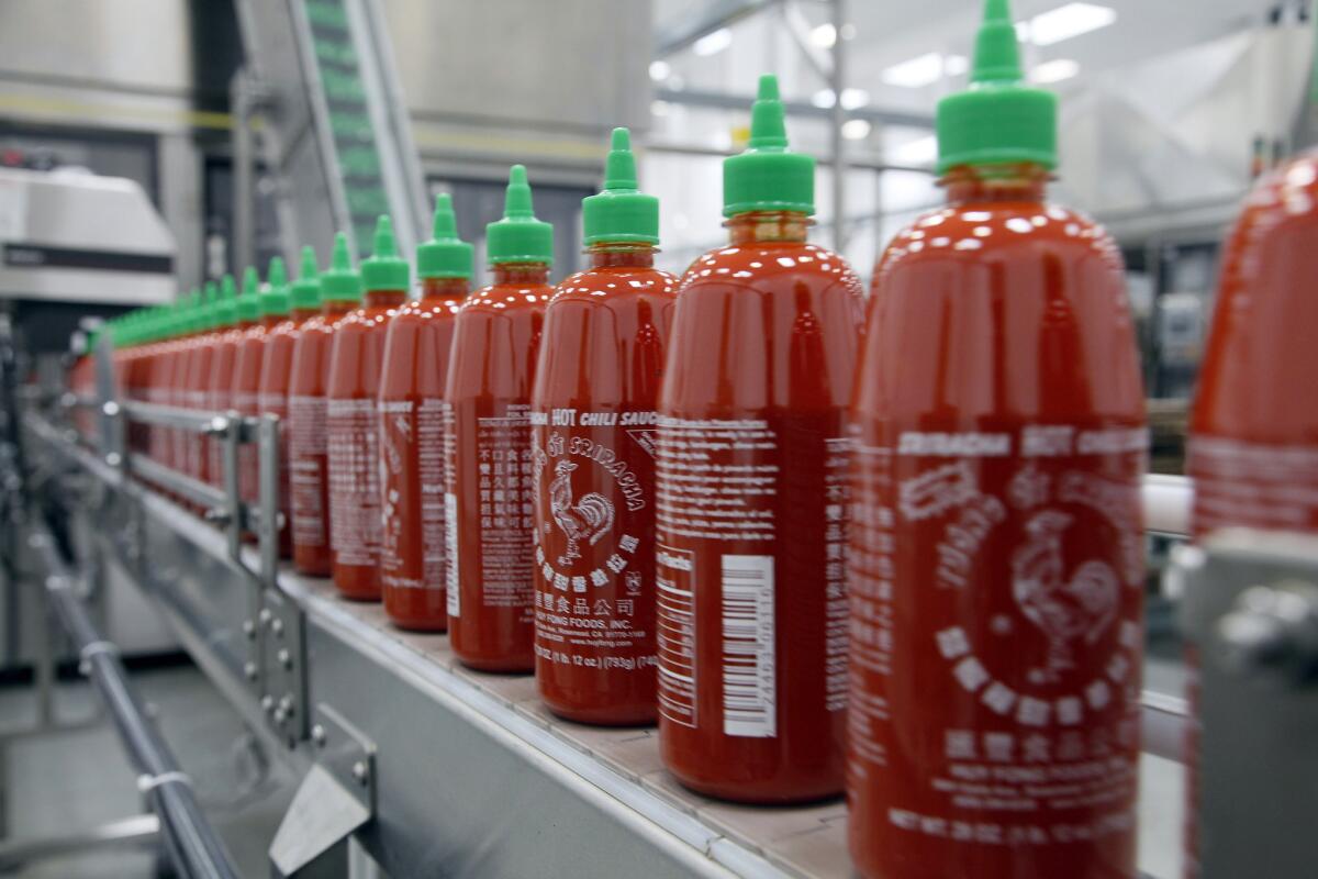 Sriracha chili sauce is produced at the Huy Fong Foods factory in Irwindale, which owners are considering moving amid a legal fight with the city.