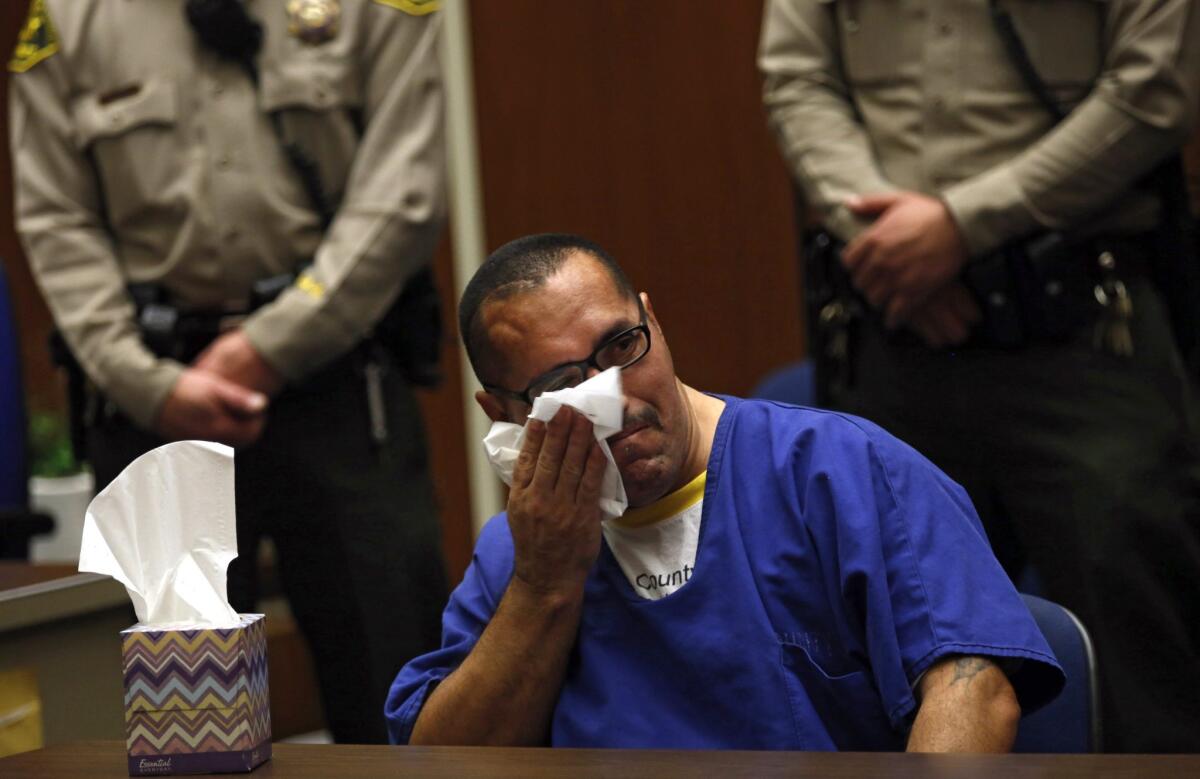 Luis Lorenzo Vargas, 46, breaks down in tears at a court hearing Monday where a Los Angeles County judge threw out his convictions for three sexual assaults.