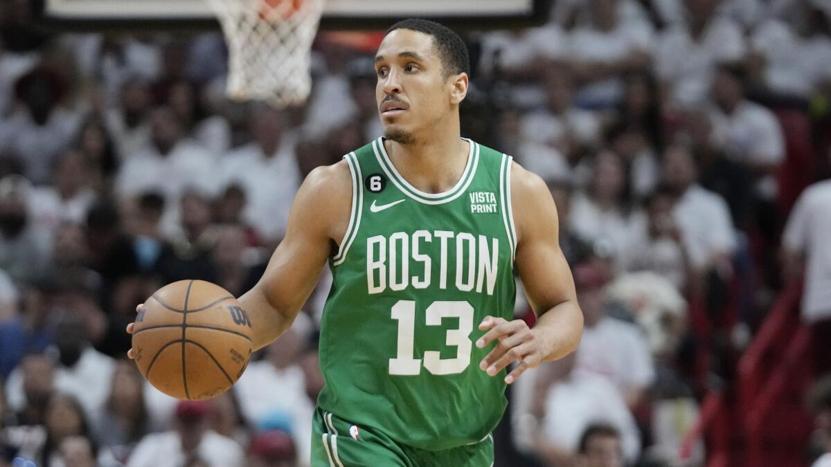 Boston Celtics guard Malcolm Brogdon dribbles against the Miami Heat on May 23, 2023, in Miami.