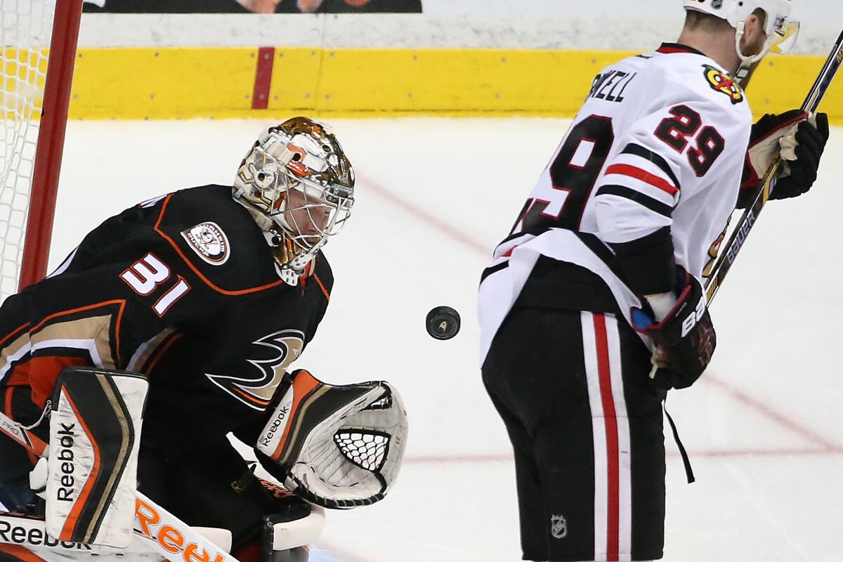 Ducks goalie Frederik Andersen blocks the puck as Blackhawks winger Bryan Bickell tries to deflect it into the net in the third period of Game 1 of the Stanley Cup Western Conference Finals at the Honda Center on Sunday.