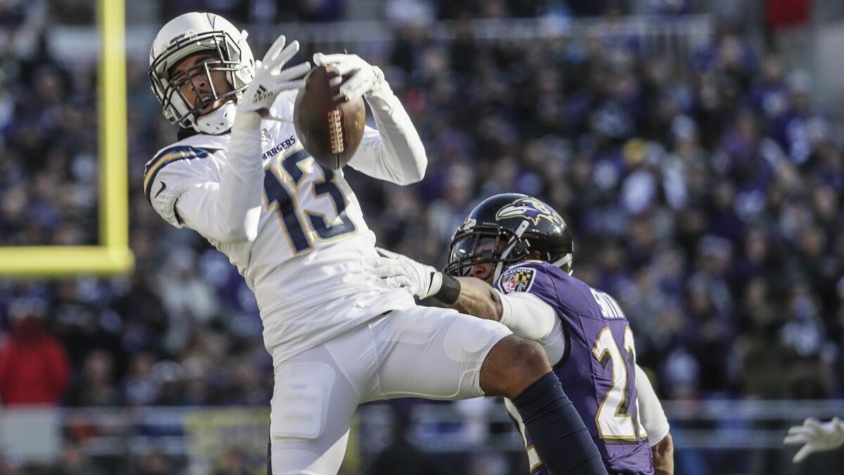 Chargers receiver Keenan Allen pulls down a 17-yard pass over Ravens cornerback Jimmy Smith during the second quarter in the AFC wild-card playoff game.