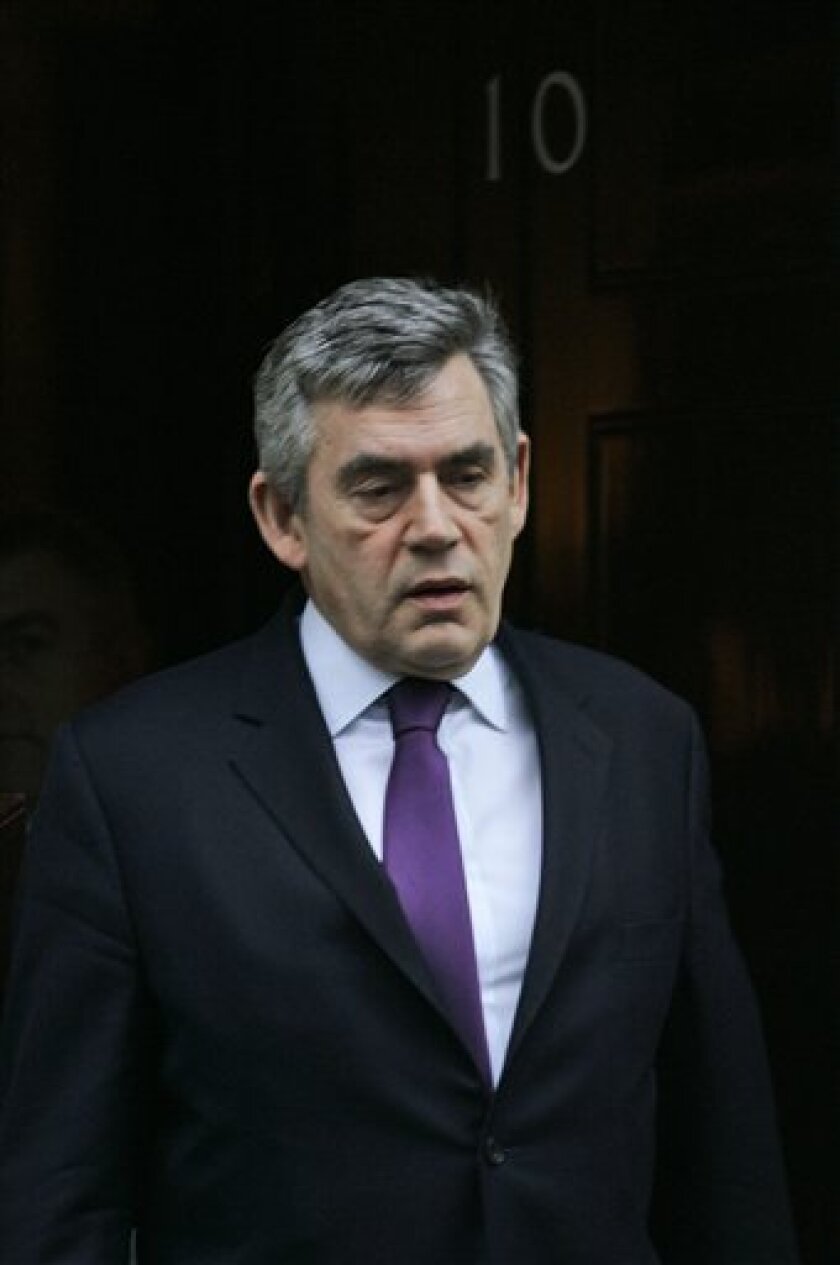 British Prime Minister Gordon Brown leaves his official residence at 10 Downing Street in central London for the Houses of Parliament to attend the weekly prime minister's questions and answers session, Wednesday Nov. 12, 2008. The Bank of England said Wednesday it expects inflation to fall to the government's target of 2 percent next year, but warned that inflation would then continue falling to well below that level as the economy contracts further. (AP Photo/Lefteris Pitarakis)