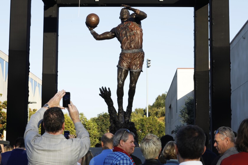 Family, friends and former teammates gather Feb. 29, 2020, for the unveiling of a statue of Hank Gathers at Loyola Marymount.