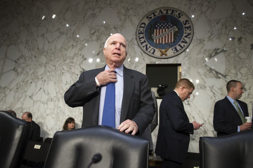 Senate Armed Services Committee Chairman John McCain, shown before a hearing last week, wants to limit further defense cuts provided for by the 2011 "sequester" agreement between President Obama and Congress.
