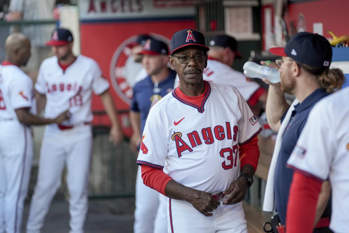 Angels manager Ron Washington walks in the dugout before a game against the Oakland Athletics in Anaheim Friday