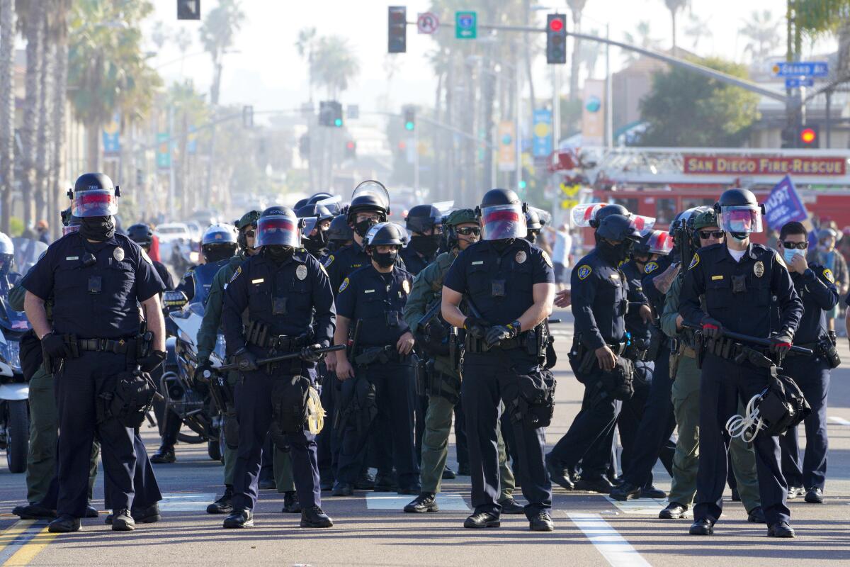 San Diego police  set up a security line  to keep pro- and anti-Trump groups apart.