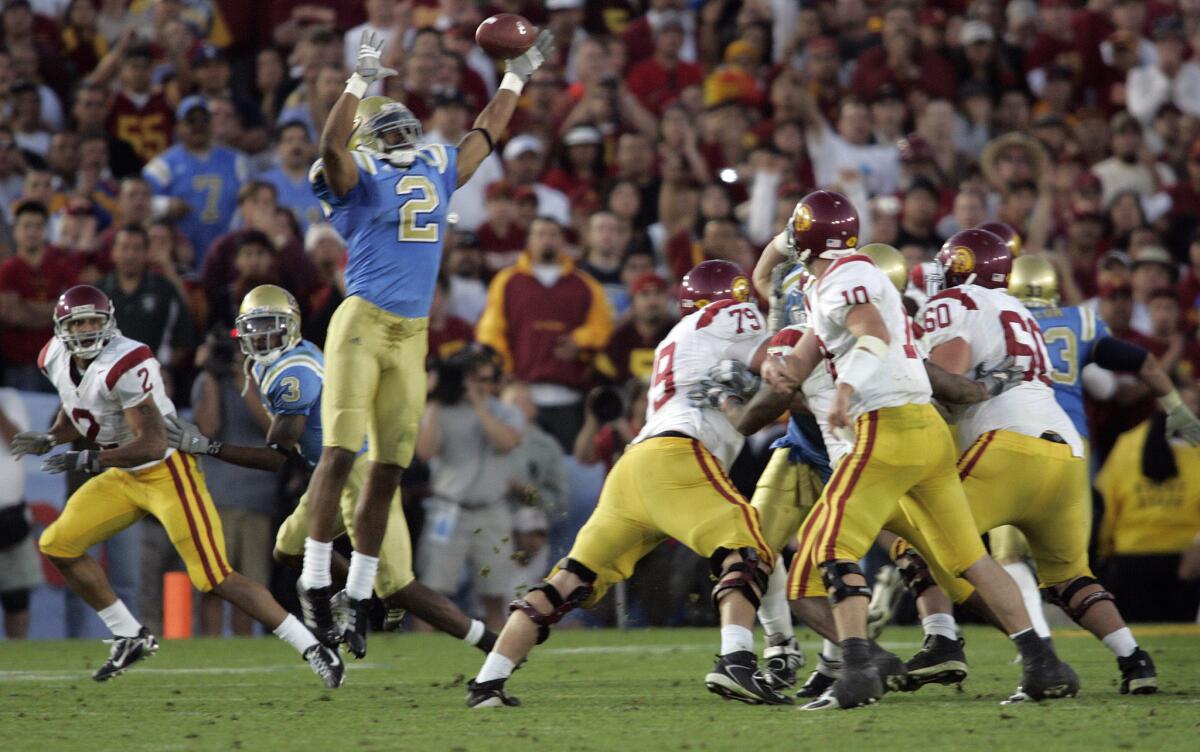 USC quarterback John David Booty throws an interception to UCLA outside linebacker Eric McNeal in the final minute of the game on Dec. 2, 2006.